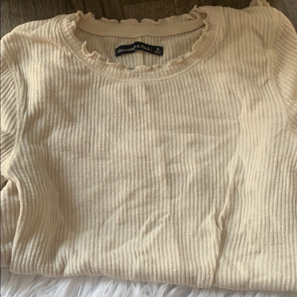 Long sleeve, indented cream color shirt